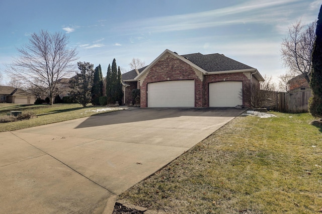 view of front facade featuring a garage and a front lawn