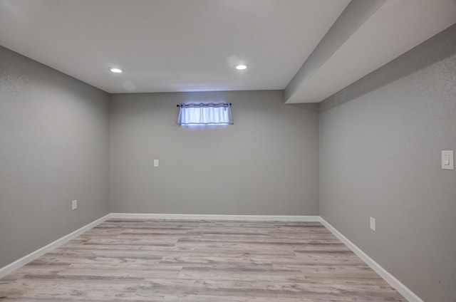 basement featuring light hardwood / wood-style flooring