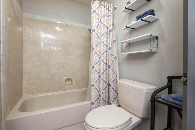 bathroom with toilet and shower / bath combo