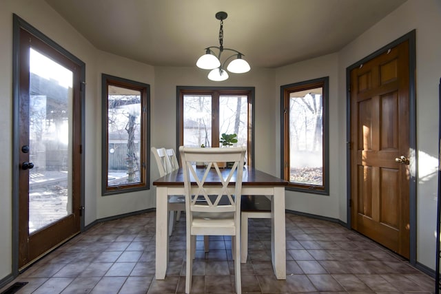 dining area featuring a chandelier