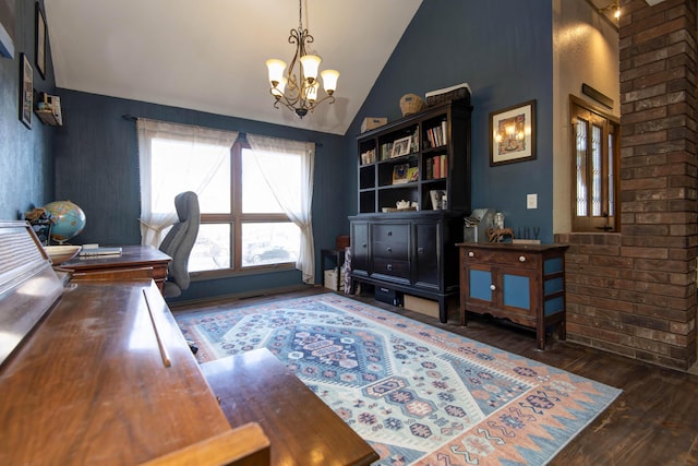 home office with dark wood-type flooring, lofted ceiling, and a notable chandelier