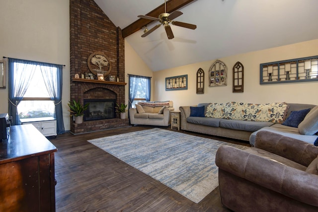 living room with ceiling fan, dark hardwood / wood-style flooring, a fireplace, high vaulted ceiling, and beamed ceiling