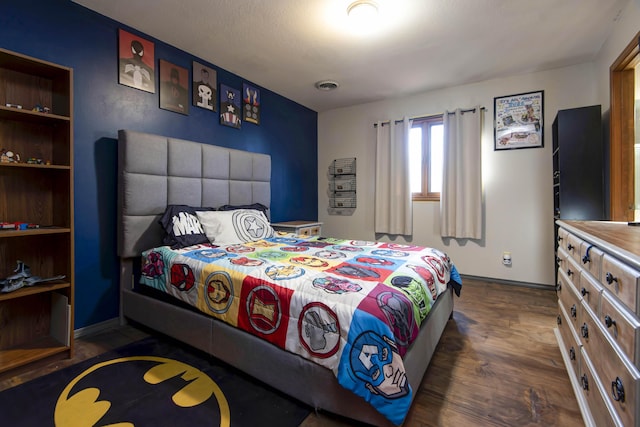 bedroom featuring dark wood-type flooring