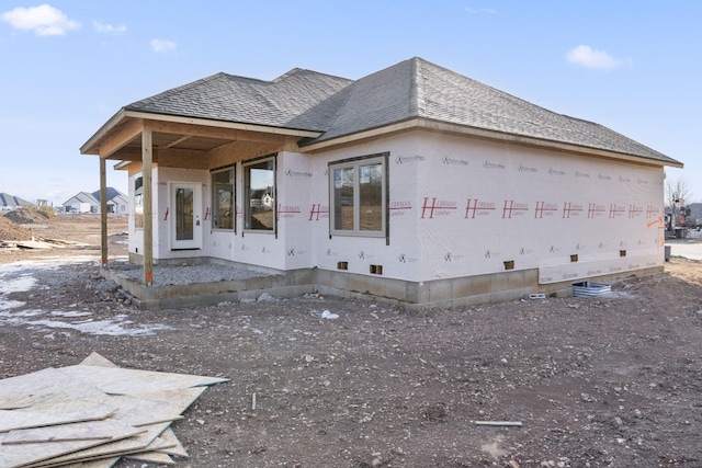 view of front of house with a shingled roof