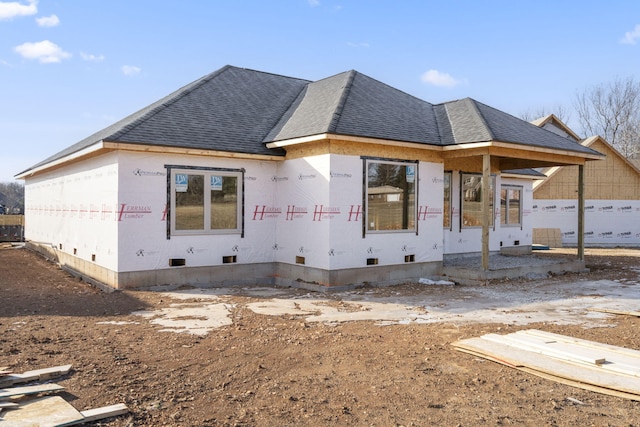 property under construction featuring crawl space and roof with shingles