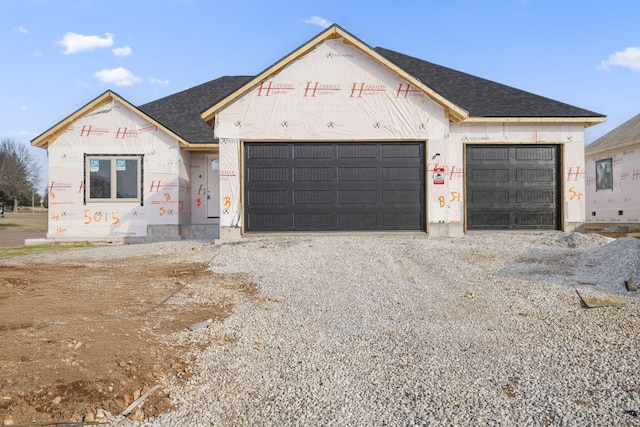 property in mid-construction featuring a garage