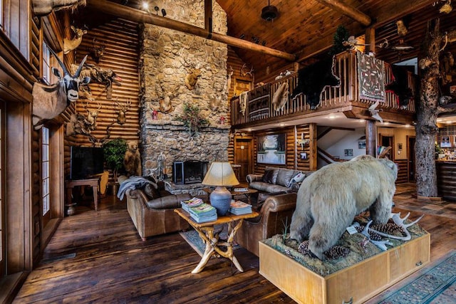 living room with wooden ceiling, log walls, hardwood / wood-style floors, and high vaulted ceiling