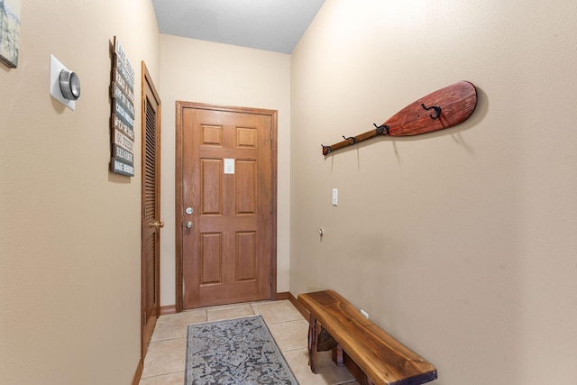 doorway to outside featuring light tile patterned floors