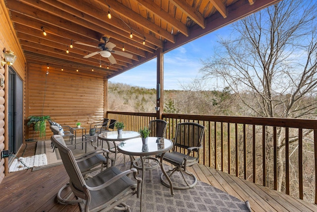 wooden deck featuring ceiling fan