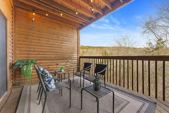 wooden balcony featuring a deck