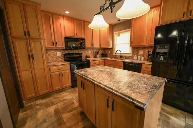 kitchen featuring decorative light fixtures, backsplash, a kitchen island, black appliances, and sink