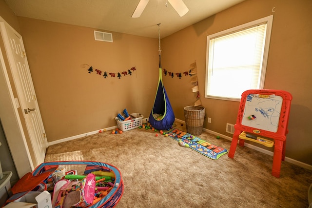 game room with ceiling fan and carpet flooring