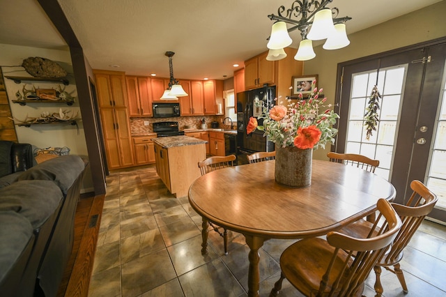 tiled dining space featuring sink