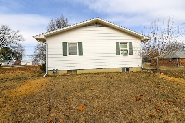 view of property exterior featuring a lawn