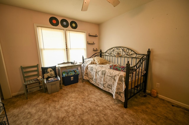 bedroom featuring ceiling fan and carpet