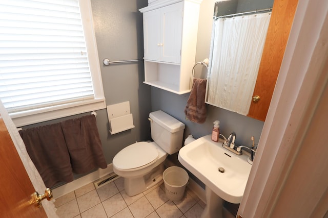 bathroom with sink, tile patterned floors, and toilet