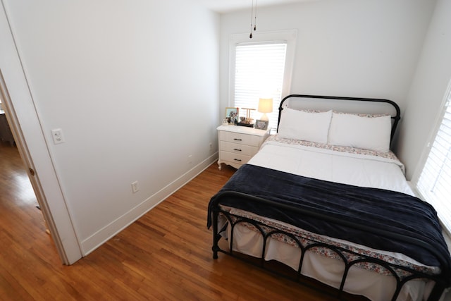 bedroom with hardwood / wood-style flooring