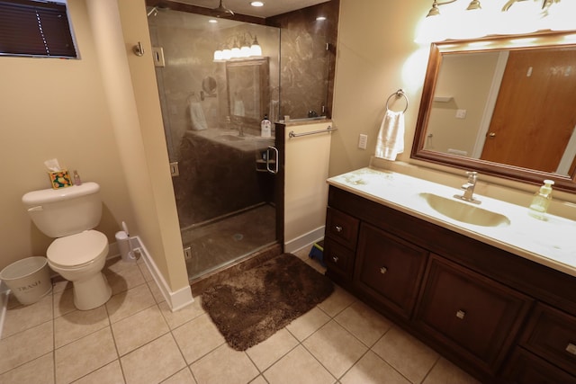 bathroom featuring an enclosed shower, vanity, tile patterned floors, and toilet