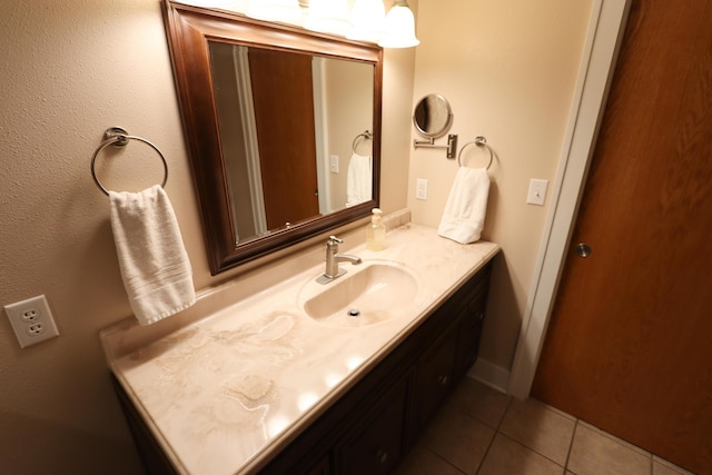 bathroom with tile patterned flooring and vanity