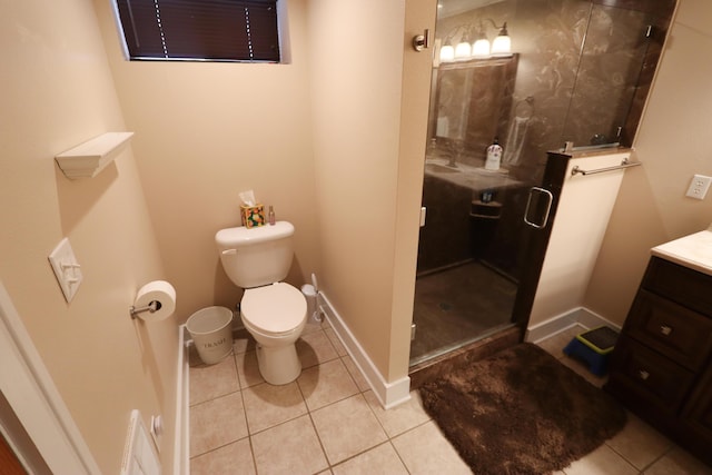 bathroom with toilet, tile patterned flooring, walk in shower, and vanity