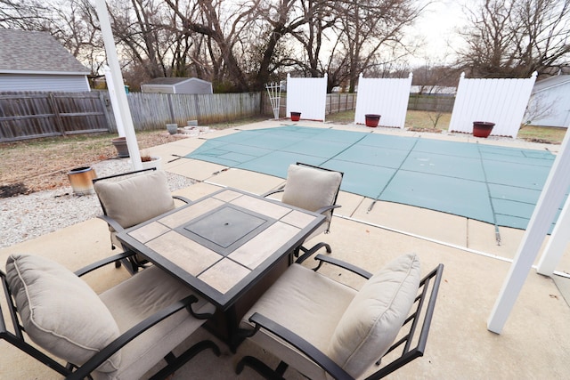 view of swimming pool with a patio area