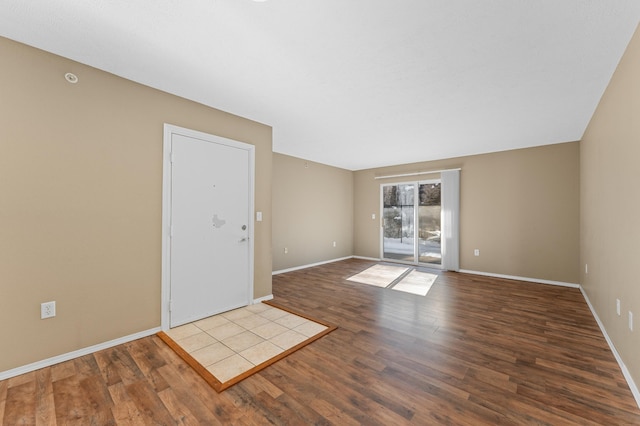 empty room with wood-type flooring