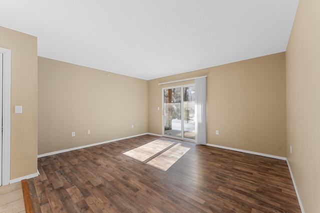 unfurnished room featuring dark hardwood / wood-style floors