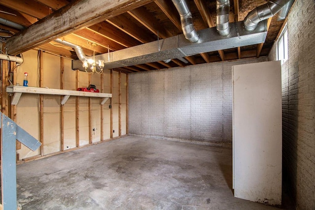 basement with brick wall