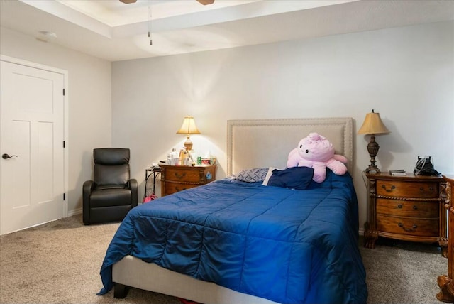 bedroom featuring ceiling fan and carpet