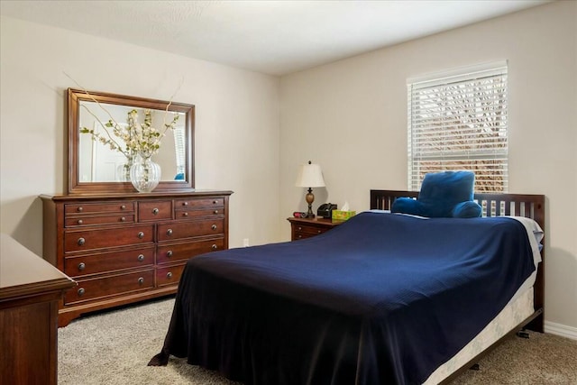 bedroom featuring light colored carpet