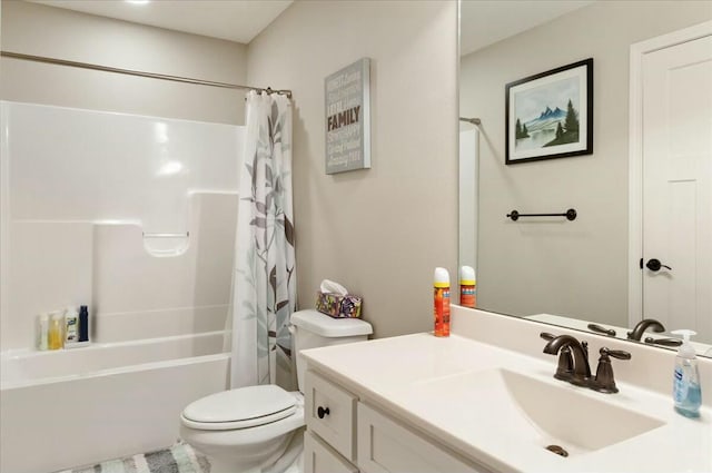 full bathroom featuring toilet, vanity, and shower / bath combo with shower curtain