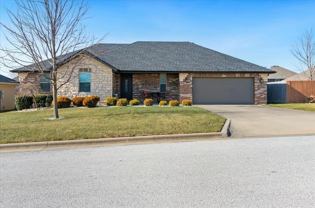 ranch-style home featuring a front yard and a garage