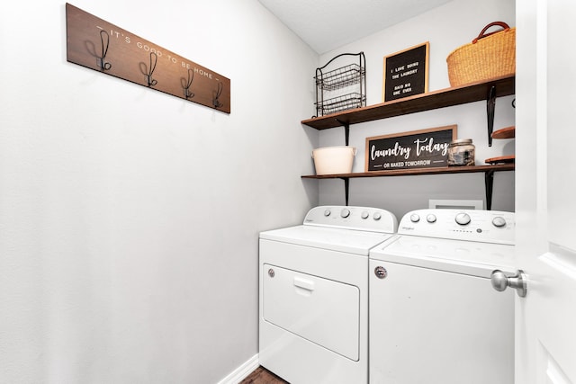 clothes washing area featuring independent washer and dryer