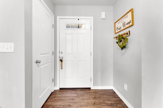 doorway with hardwood / wood-style flooring