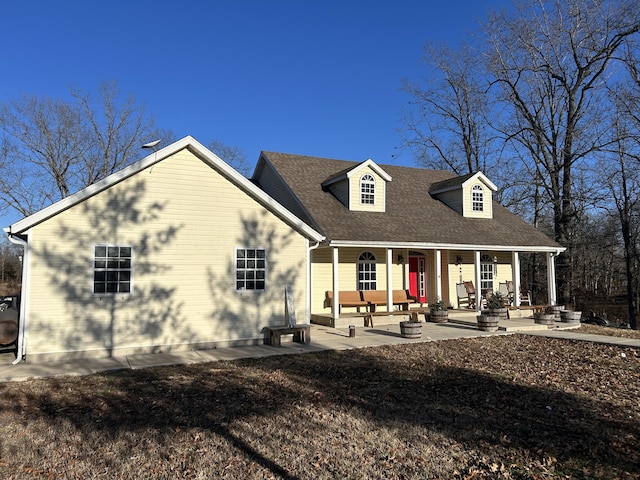 view of front of home with covered porch and a patio