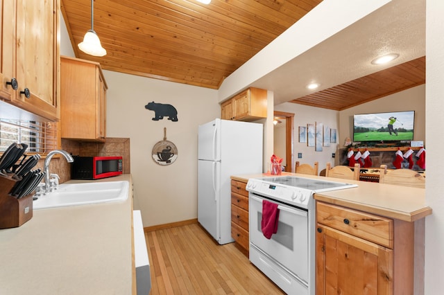 kitchen with pendant lighting, white appliances, wood ceiling, sink, and vaulted ceiling