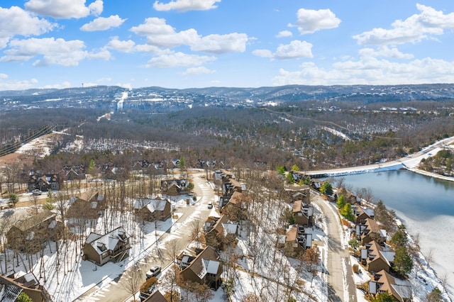 drone / aerial view featuring a water and mountain view