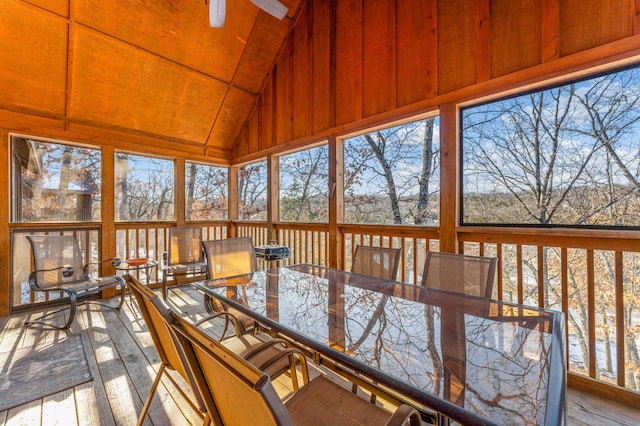 unfurnished sunroom featuring plenty of natural light and lofted ceiling