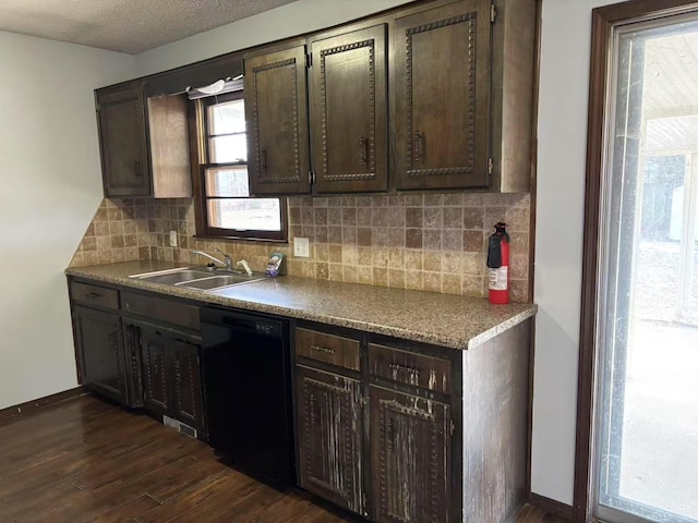 kitchen with dark brown cabinets, dishwasher, sink, backsplash, and dark hardwood / wood-style floors