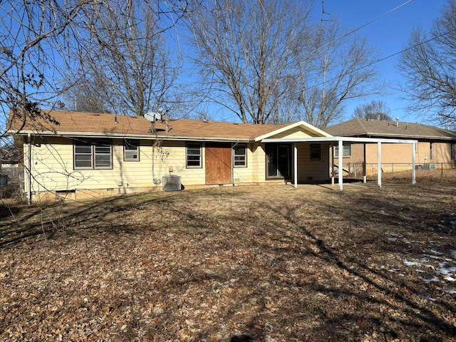 rear view of property featuring central AC unit