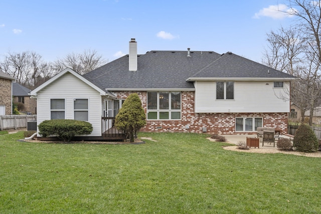 rear view of house with a patio area and a yard