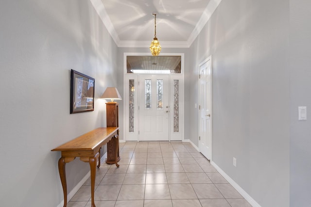 tiled entryway featuring ornamental molding