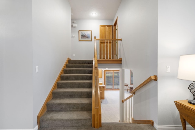 staircase with carpet flooring