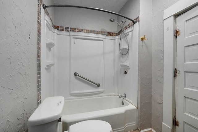 bathroom with toilet and shower / bathing tub combination