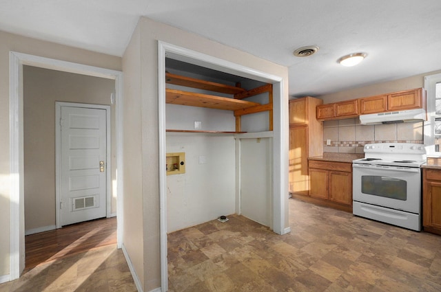 kitchen featuring white range with electric stovetop and tasteful backsplash