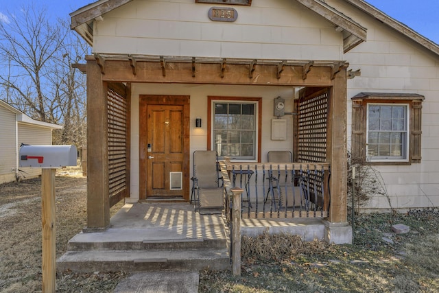 doorway to property featuring a porch