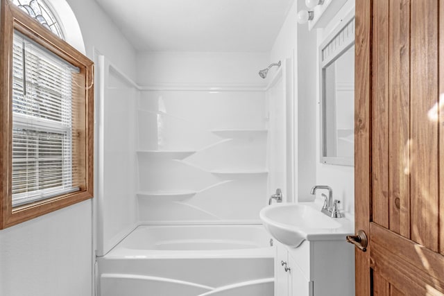 bathroom with shower / bathing tub combination and vanity