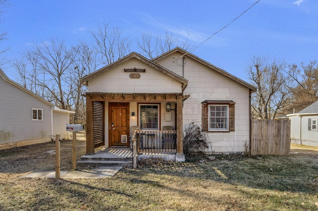 bungalow featuring a porch and a front yard