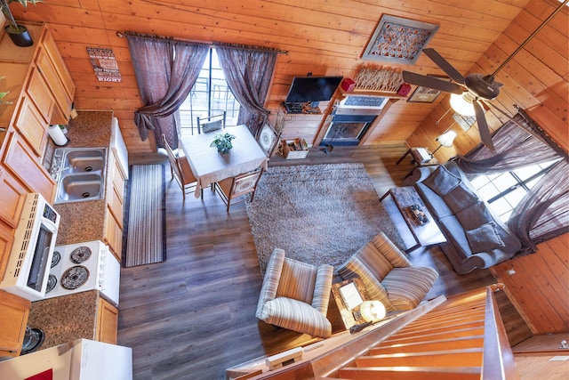 unfurnished living room with wooden ceiling, a fireplace, sink, high vaulted ceiling, and dark hardwood / wood-style floors