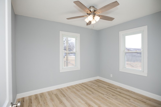 unfurnished room with light hardwood / wood-style floors, ceiling fan, and plenty of natural light